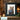 Charcoal gray burl wood picture frame displayed in rustic cabin decor